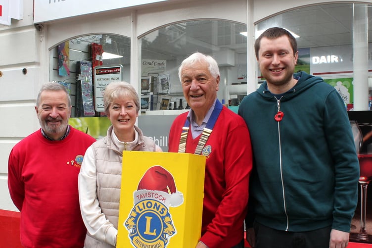 Tavistock Lions president Alan Wroath and Lion Chris Northey with Nicola and Peter Bradley, Whitchurch Post Office owners supporting the Lions festive postal service..