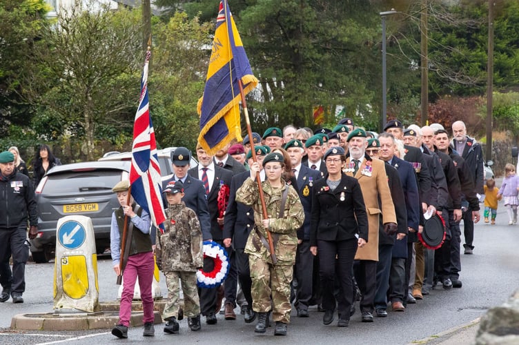 Princetown Remembrance Sunday parade from the church to the war memorial. 