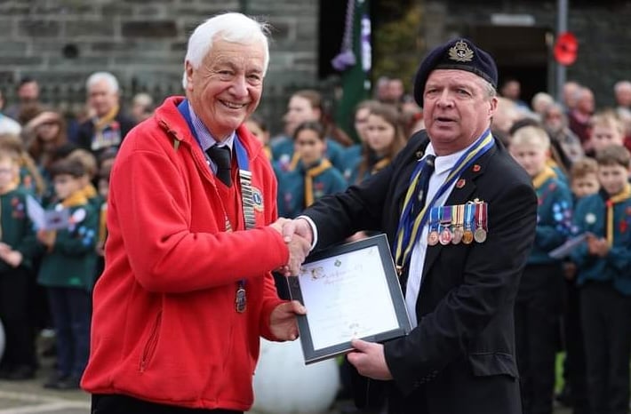 Tavistock Lions President Alan Wroath (left) presented with a Royal British Legion certiticate by RBL branch chairman Chris Smerdon, thanking the club for its support to the RBL branch.