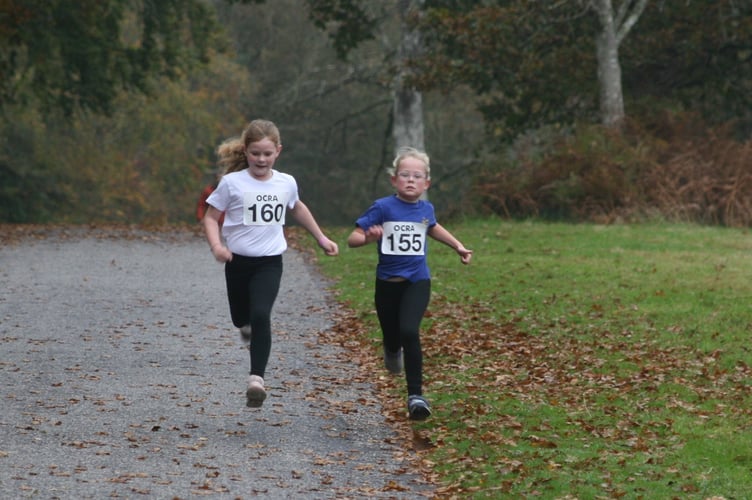 Battling for the line at the Castle Drogo cross-country round for primary schools. The event is organised by Okehampton Community & Recreation Association. 