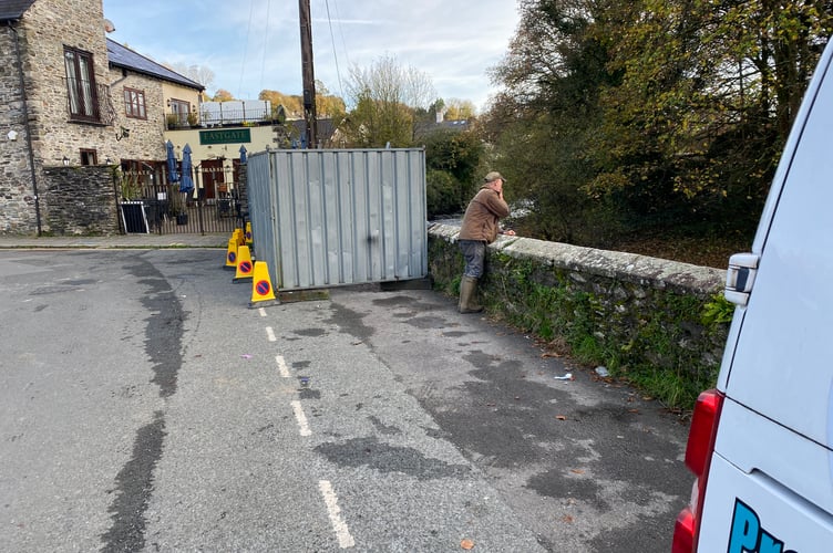 The Market Road River Tavy wall fenced off after part of it was knocked down by a traffic collision on Monday.