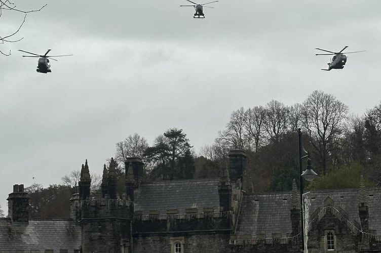 A military helicopter flypast pays tribute to former Commando pilot Lt Col Peter Cameron during his funeral procession.