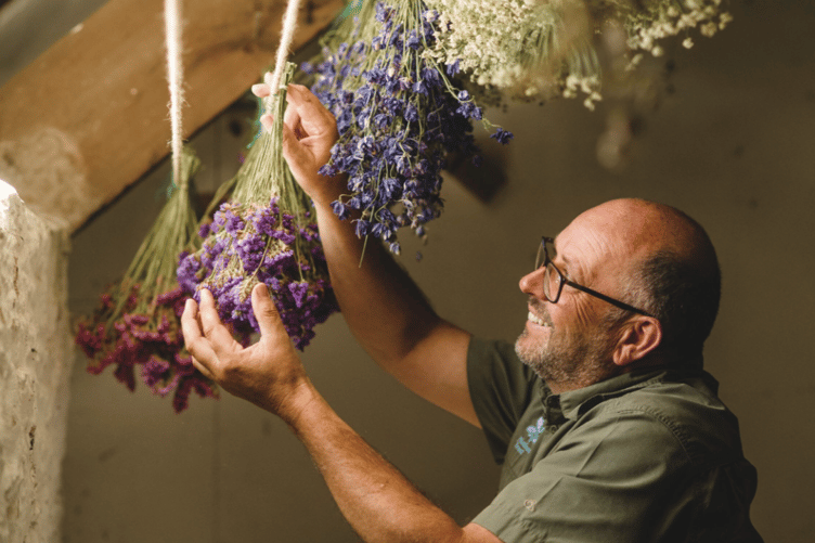 Cothele National Trust head gardener Dave Bouch begins building the Christmas garland by starting with the first of 30,000 dried flowers