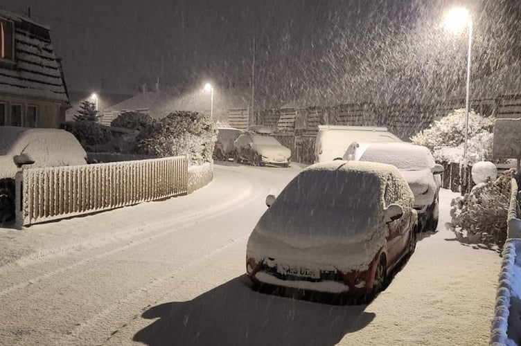 Princetown hit by heavy snow today, closing shops and  the school and closing roads.