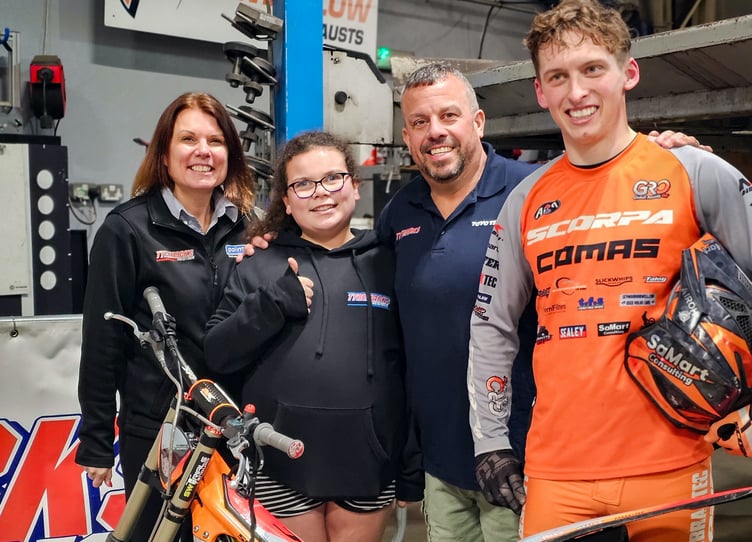 Farrah, Kelsey and Mark Tillyer of TyreMarks with trail biking champion Billy Green, right, after his display at the garage
