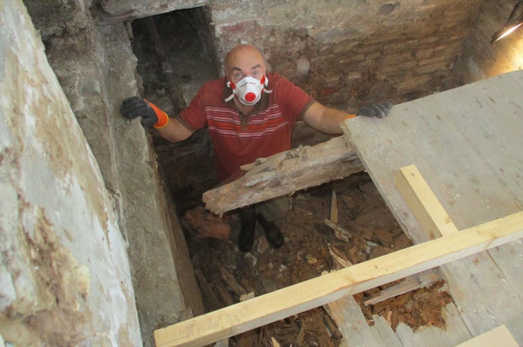 The Milton Abbot Village Hall being restored by a volunteer