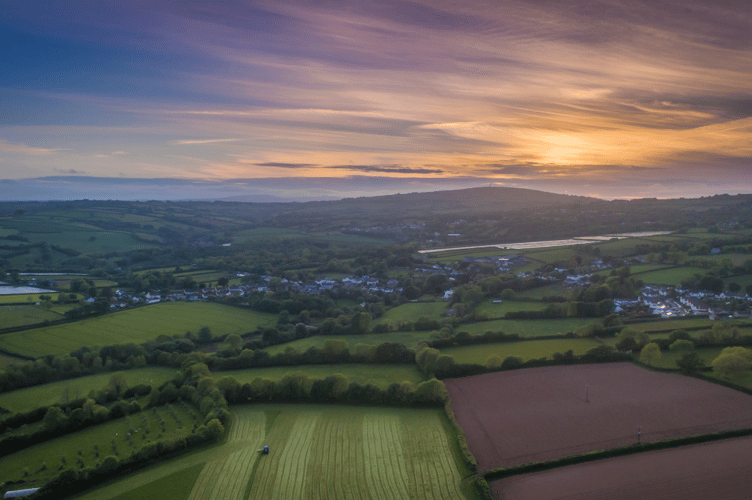 An aerial view of the Tamar Valley National Landscape with Kit Hill in the distance