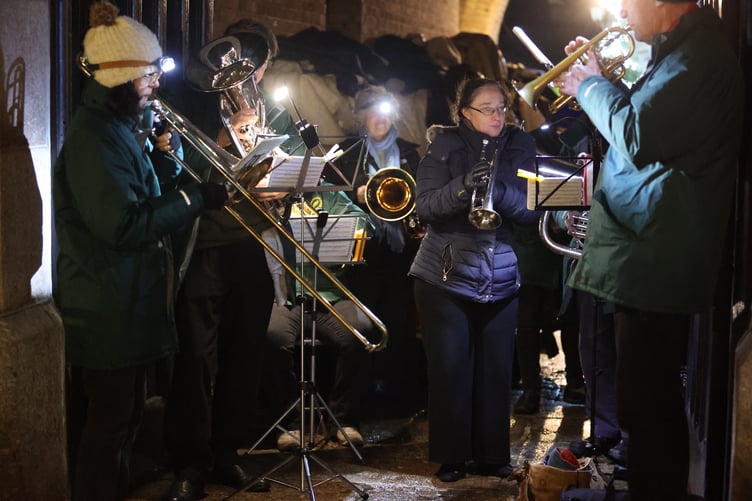 Youngsters join in the ceremonial lighting of Tavistock Lions' Trees of Light last week.