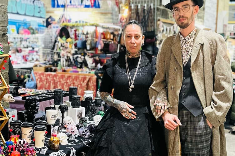 Stall holders Ben Thornton and Donna McDonald of Tavistock Pannier Market were pleased with trade, despite the reduction in outdoor trractions during Friday night's downscaled Dickensian Evening.
