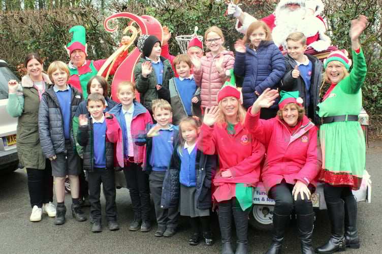 Gulworthy School pupils celebrate the visit of Tavistock Lions Santa. Picture by Steve Grummitt.