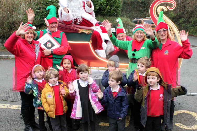 Lamerton school children are so happy to meet Tavistock Lions Santa on his fact-finding tour of schools to find out what the youngsters might want for Christmas. 