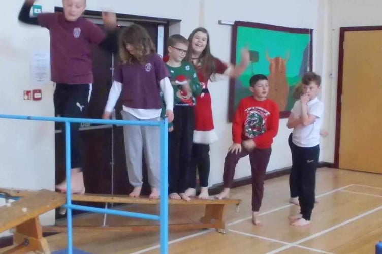 Horrabridge School enjoying their Santa Run obstacle course in aid of St Luke's Hospice.