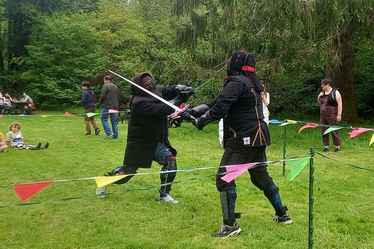 Members of the historical fencing group at Okehampton Castle for Bluebell Sunday