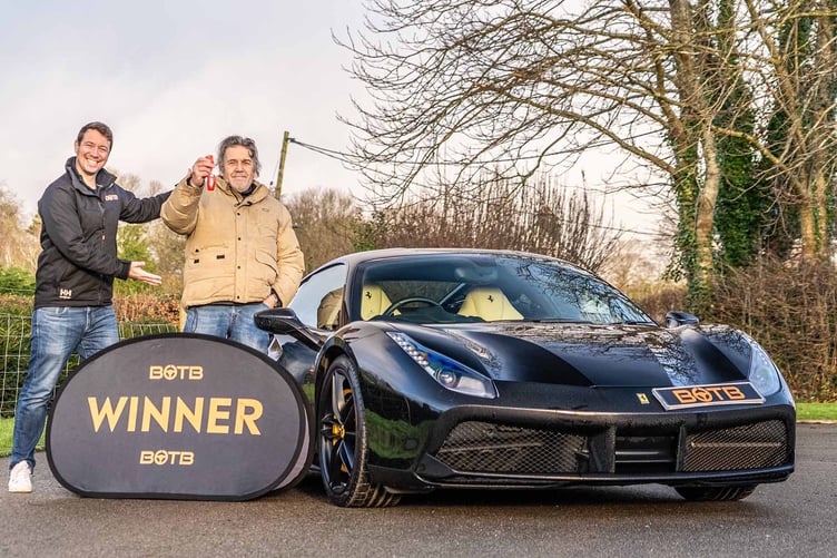 Lucky Gerald Hallam, of Buckland Monachorum wins a Ferrari.