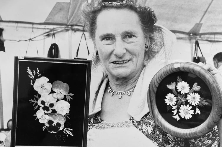 Peggy Hall from Holcombe and her display of pressed flowers at Powderham Castle Craft Fair in August 1987