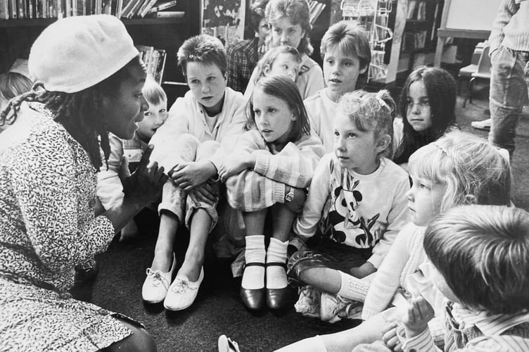 Eintow Pearl Springer from Trinidad entertains youngsters at Teignmouth Library with stories in August 1986