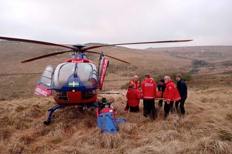 Tavistock Dartmoor Search & Rescue team deliver a casualty to Devon Air Ambulance near Two Bridges.