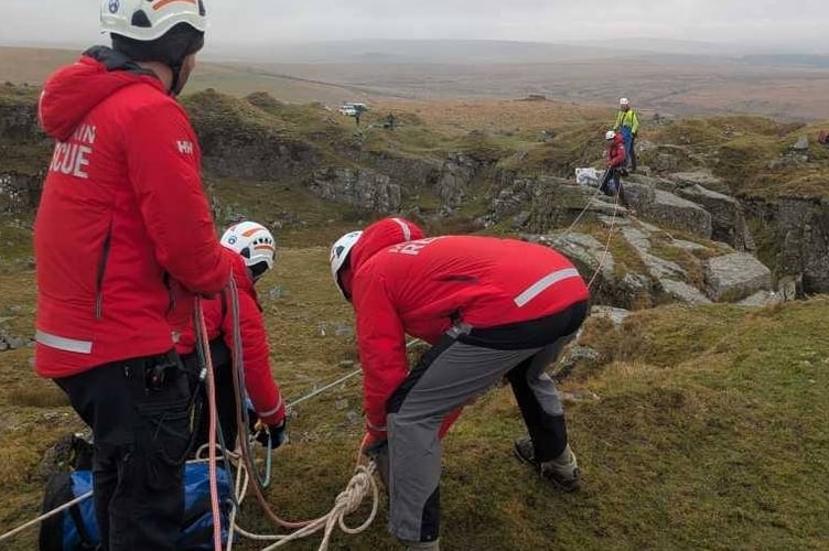 Tavistock Dartmoor Search & Rescue Team lower a stranded sheep safely from its rocky perch using their rope skills. 
