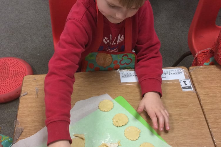 Making biscuits to mark Winnie the Pooh Day at Horrabridge School