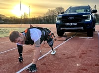 Royal Marine amputee's record vehicle pull on running track