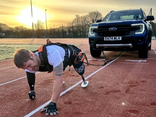 Royal Marine amputee's record vehicle pull on running track