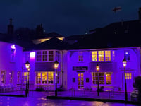 Yelverton Inn floodlit in purple commemorates Holocaust Memorial Day 