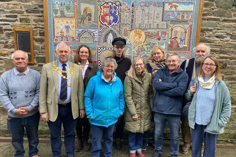A new-look mosaic has been unveiled at Tavistock Pannier Market after repairs by volunteers.