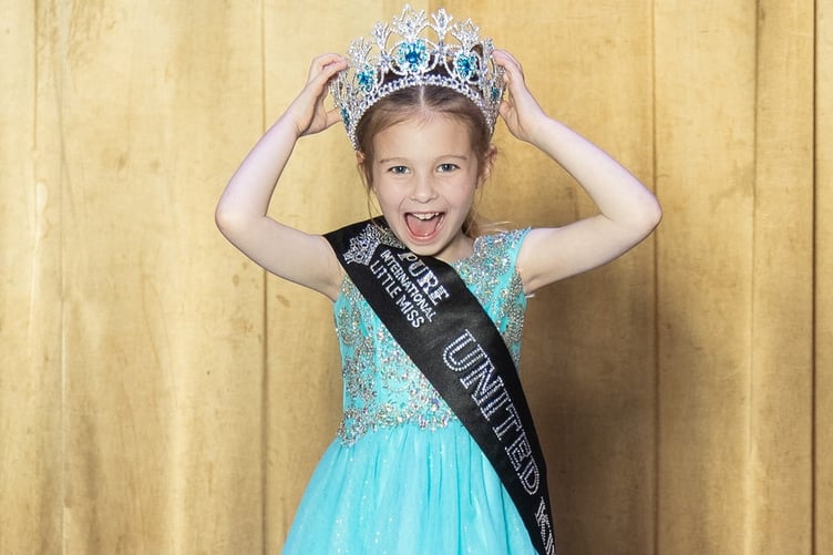 Smiling for success - Scarlett Hearn celebrates winning the UK finals of the Pure US pageant.