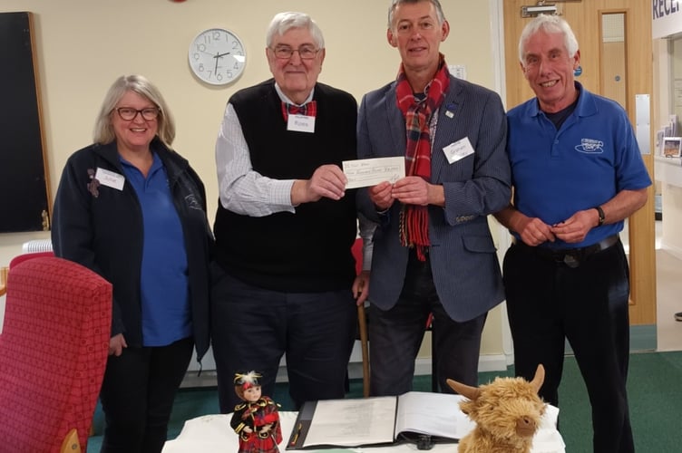 Tavistock Memory Cafe receives a charity donation from the Masonic Sanctuary Lodge. Pictured L to R are cafe volunteers Julie Parsons, Ross Heriot (Masonic Lodge) Graham Coiley and Chris Corden. 