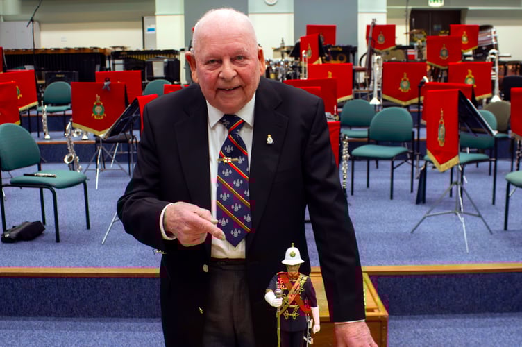 Former Royal Marines Musician George Latham with his treasured statue