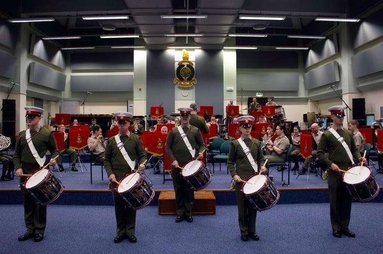 Drummers from the RM Band Plymouth perform in honour of George Latham.