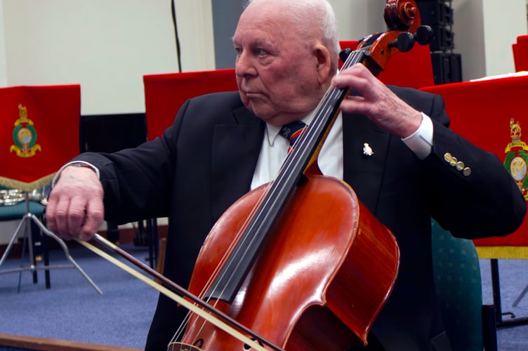 George Latham shows RM musicians his cello skills.