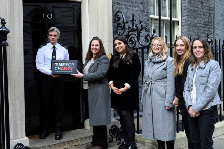 Campaigners from the League Against Cruel Sports and Time for Change Coalition Against Hunting handing in the petition at 10 Downing Street
