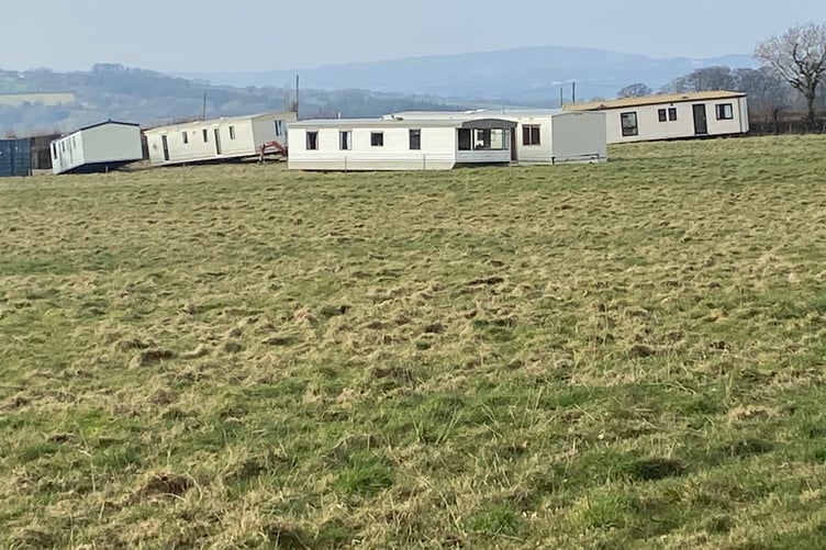 Some of the mobile homes which have been put on the land at Crapstone, causing concern for some neighbours.