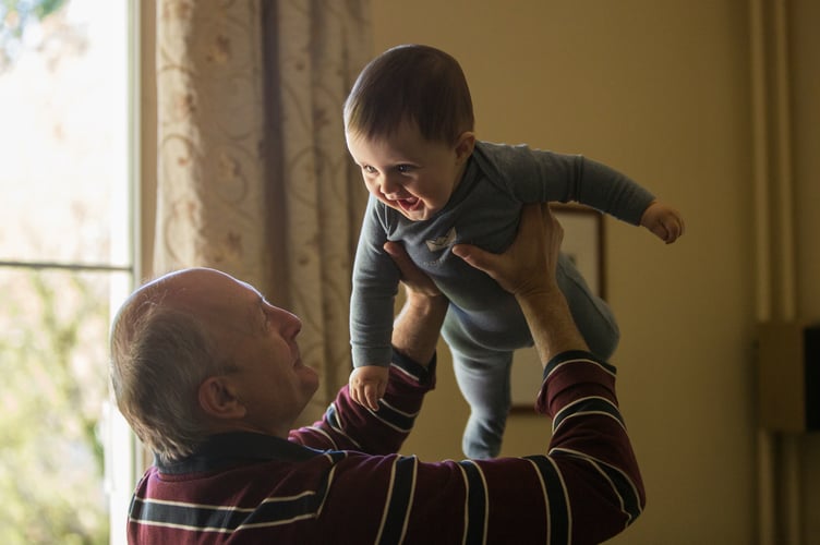 There's a special bond between grandad and grandson, as John Howells has found out, four times over. Picture: Johnny Cohen/Unsplash.