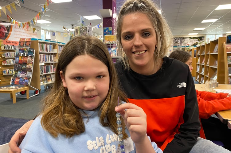Nikki Pethick and daughter Olivia, 8, making bead bracelets at Tavistock Library