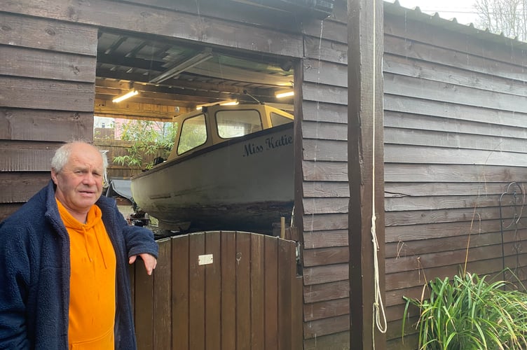 Ian Lashbrook and his boat in his garden shed - but not for much longer. 