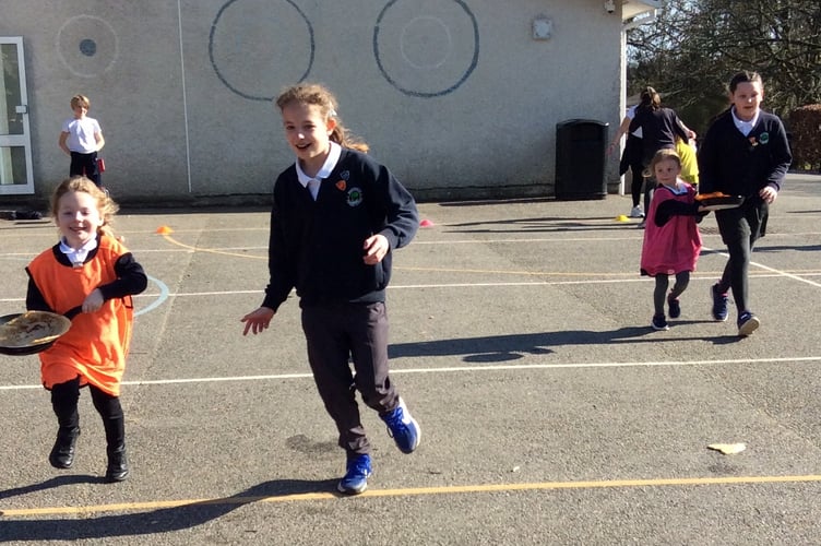 Even the smallest joined in the pancake race at Whitchurch School.