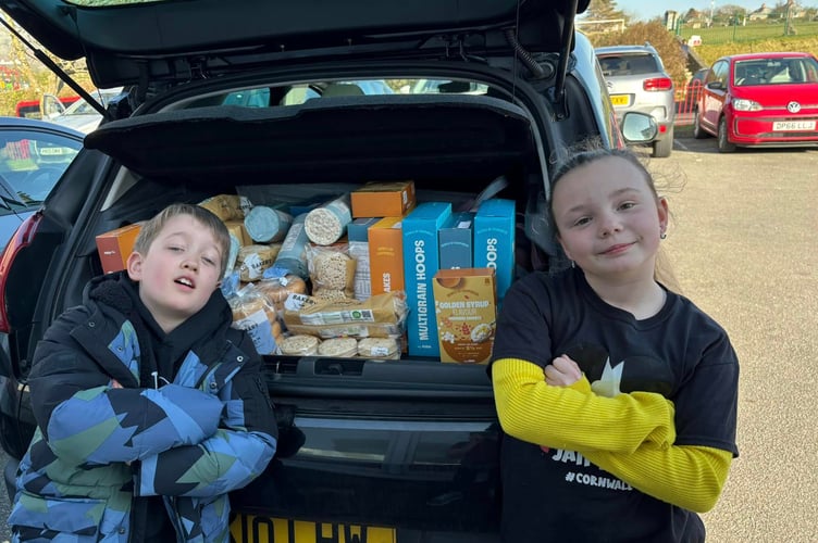 Fletcher Worth and Mika Pedrick, both year 4 at Callington Primary School helped the Callington Lions with their monthly delivery of breakfast cereals and snacks for the school. (Picture: Callington Lions)