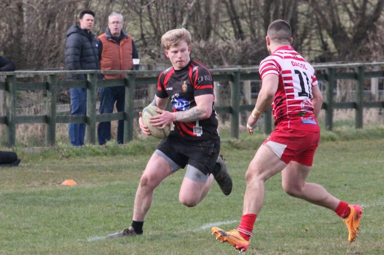 Tom Burgess heads up the wing for Tavistock RFC