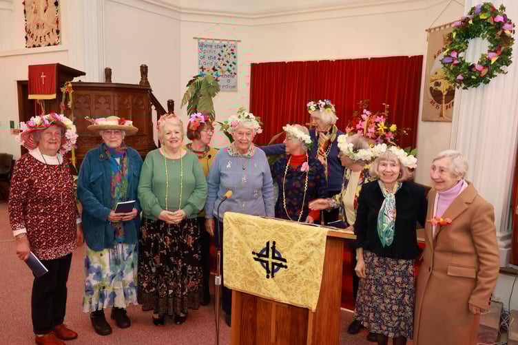 All those taking part in the service at Rock Methodist Church wore floral garlands and hats