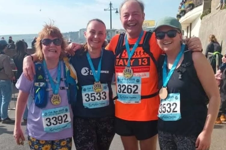 A tired but elated Dotty King and running buddies Emma Williams and Denise Bettye at the finishing line of the gruelling Grizzly running race.
