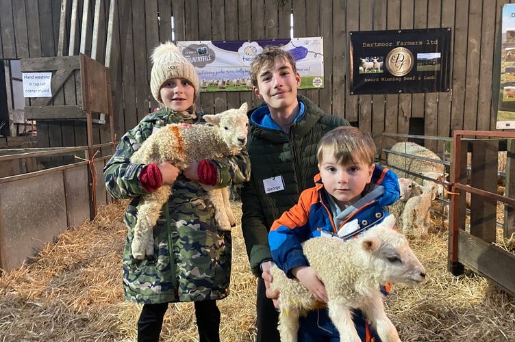 Arnie, 4, Pixie and George explaining to visitors how food gets from farm to the table at Greenwell Farm, Yelverton