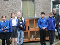 Men in Sheds build primary school children a hutch