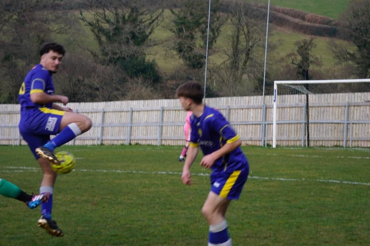 Jamal Bokhammas wins the ball for Okehampton Argyle