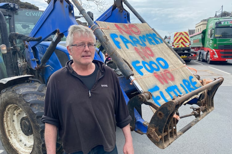 Angry Bere Alston farmer John Hillson protesting at cutbacks in farming subsidy and inheritance tax increases. 