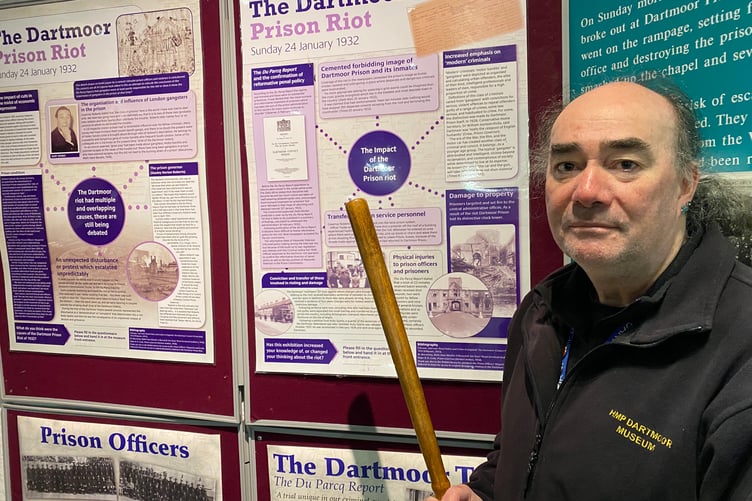 Dartmoor Prison Museum manager wields the newly acquired police truncheon which was used in the infamous 1932 prison riot.