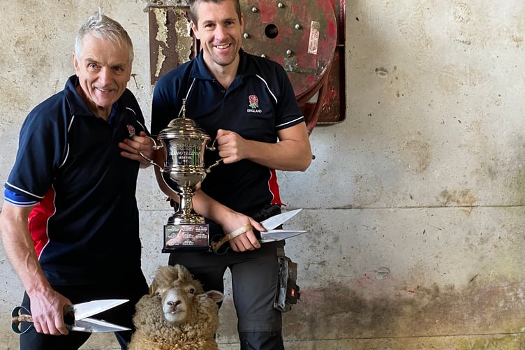 Master sheep shearing team father and son George and Andrew Mudge show off their six nations trophy.