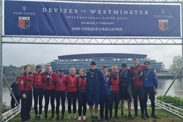 Mount Kelly College student paddlers celebrating their river canoe challenge.