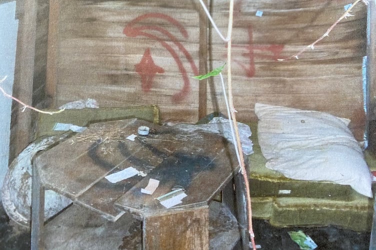 An author is seeking the mystery squatter who lived in this shed in Tavistock..